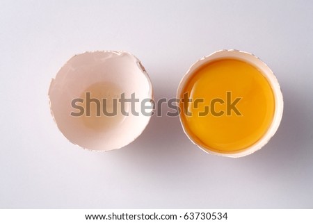 stock image of the cracked egg with yolk