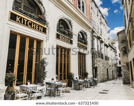 Coffee house with a street patio in an old architecture