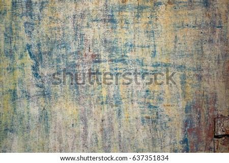 Multicolored peeling wall texture and background. Surface with brush strokes, stains. The colors like used by the Impressionists.