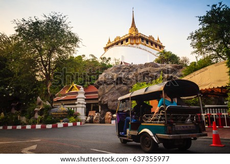 Tourist is visiting to Wat Saket Ratcha Wora Maha Wihan (Wat Phu Khao Thong, Golden Mount temple), a popular Bangkok tourist attraction and has become one of the symbols of the city. Royalty-Free Stock Photo #637355977
