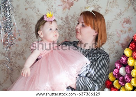 Portrait of a little baby girl with her mother