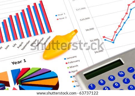 Different types of charts with a calculator and orange highlighter pen
