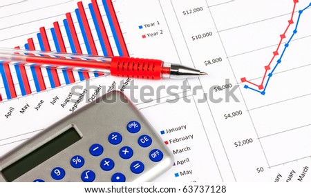 Different types of charts with a calculator and red pen