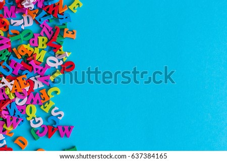 Template with many color letters, ABC with blue background and empty space for text. Business and education concept