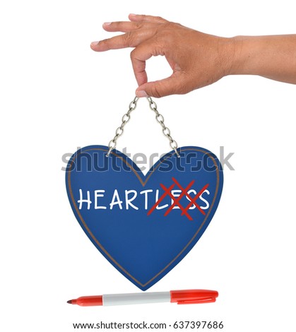 Heartless Heart Blue Sign held by hand with red felt tip marker isolated on white background