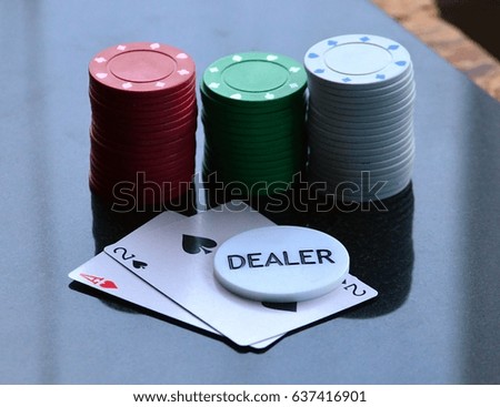 Poker chips cards and dealer chip