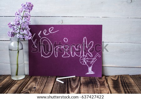 Free drink sign on violet chalk board