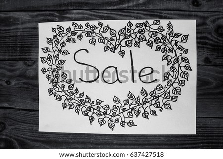 black handmade title SALE on wooden background