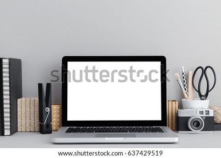 Laptop macbook computer, office supplies, books and camera at home or studio. Royalty-Free Stock Photo #637429519