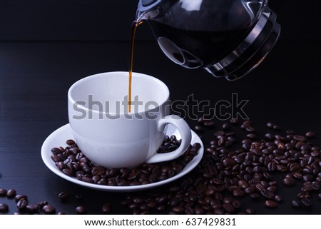 Poun black coffee with coffee beans on background black