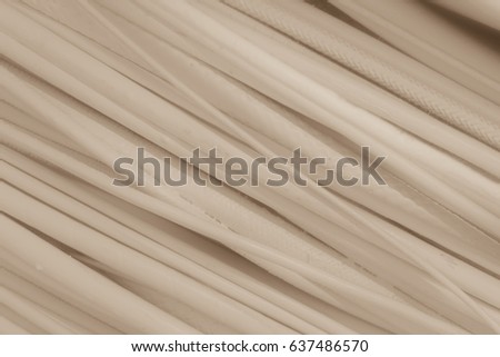 Creamy soft background.  Texture and soft, diagonal lines make up this sepia toned, presentation backdrop.