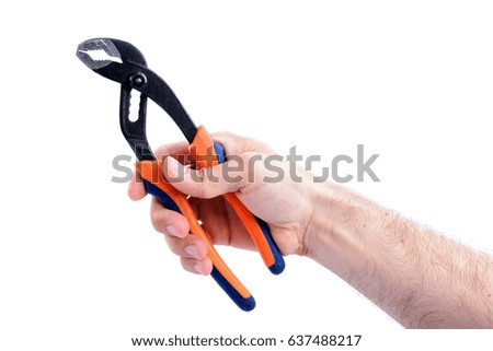 man's hand hold adjustable wrench with orange and blue handle isolated on white background close-up