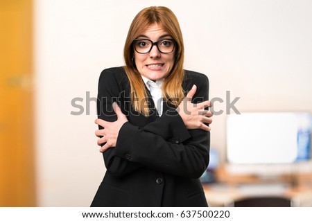 Young business woman freezing on unfocused background