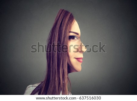surrealistic portrait front with cut out profile of a woman isolated on grey wall background