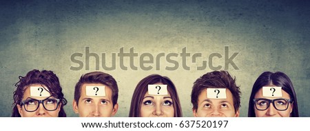 Multiethnic group of thinking people with question mark looking up Royalty-Free Stock Photo #637520197