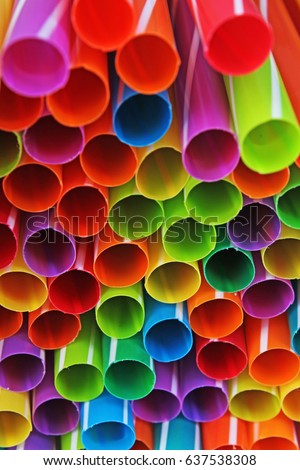 Fancy straw art background. Abstract wallpaper of colored fancy straws. Rainbow colored colorful pattern texture. Party concept studio photo of mixed  fancy straws.