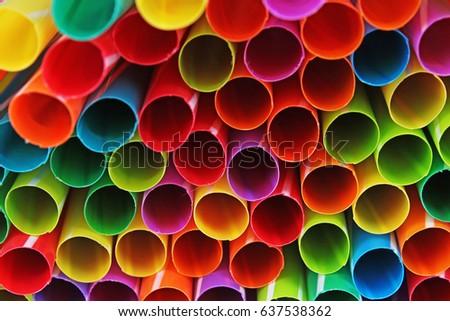 Fancy straw art background. Abstract wallpaper of colored fancy straws. Rainbow colored colorful pattern texture. Party concept studio photo of mixed  fancy straws.