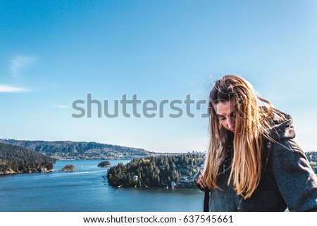 Photo of Backpacker Girl on top of Quarry Rock at North Vancouver, BC, Canada