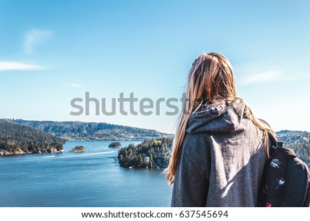 Photo of Backpacker Girl on top of Quarry Rock at North Vancouver, BC, Canada