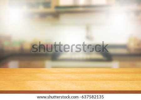 Empty wooden table and blurred kitchen background.can be used for montage or display your products.