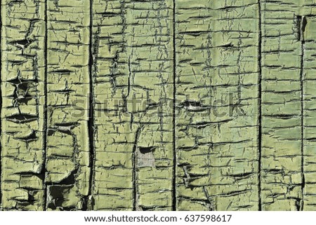 Cracked and peeled paint abstract background texture.