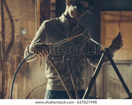 Welding device hanging in workplace
