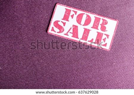 For Sale sign on red background