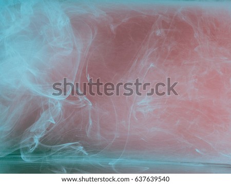 Abstract colored background. Colored smoke, ink in water, the patterns of the universe. Abstract movement, frozen multicolor flow of paint. Horizontal photo with soft focus, blurred backdrop.