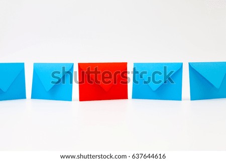 Different colored envelopes on the white background