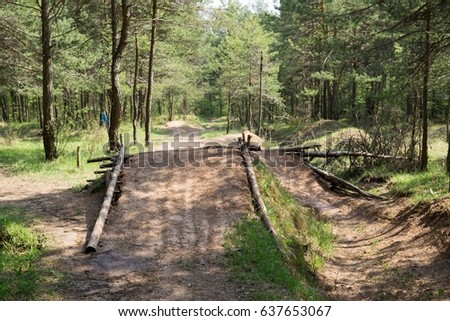 Jumping pump track trail for bicycle built in the middle of the woods. Slovakia