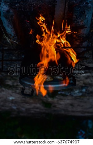 Burning firewood for cooking