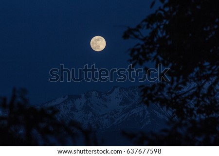 Moon rising in the mountains