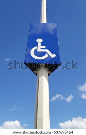 sign indicating parking spaces reserved for the disabled