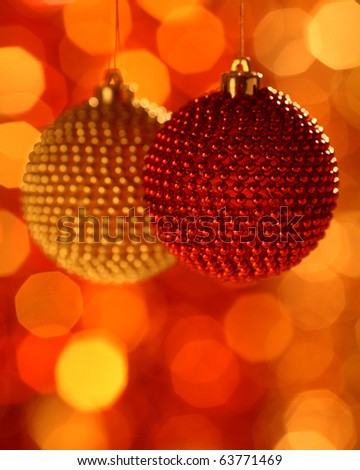 Two Christmas ball against blurred background