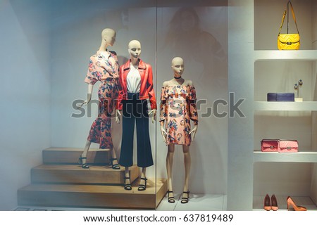 storefront with women's clothing and shoes, modern fashion clothes Royalty-Free Stock Photo #637819489