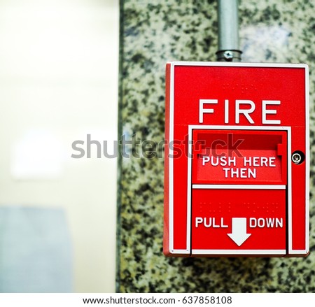 fire alarm sign/switch on marble wall and white background