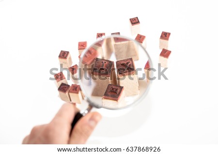 Letter molds under magnifying glass