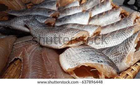 Dried salted  fish on bamboo basket