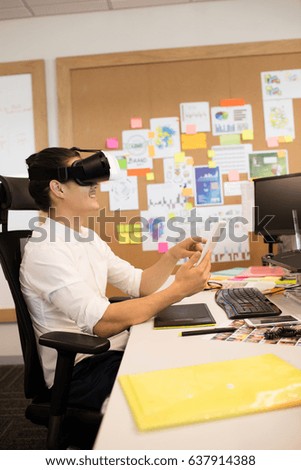 Creative businessman wearing vr glasses in office