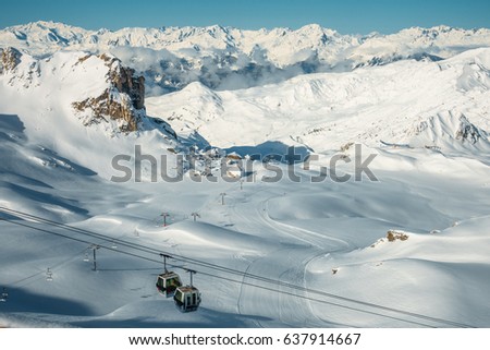View from the top of a mountain with two gondolas going to the top, France, La Plagne Royalty-Free Stock Photo #637914667