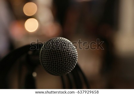 in front of a microphone