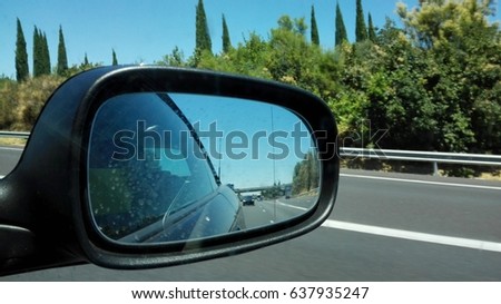 Side mirror view of the highway in the south of France.