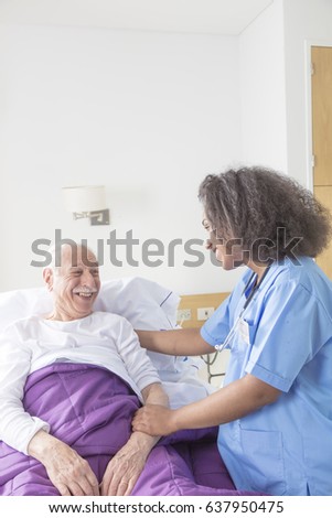 Reassuring confident african female doctor visiting elderly caucasian patient in hospital bed.