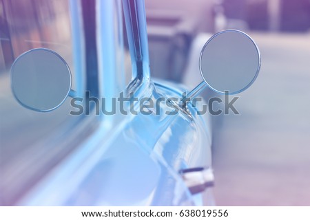 side rear view mirror of vintage car window