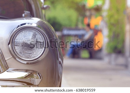 Closeup of front headlight of vintage car