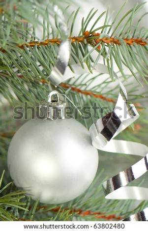 Silver christmas balls with a christmas tree