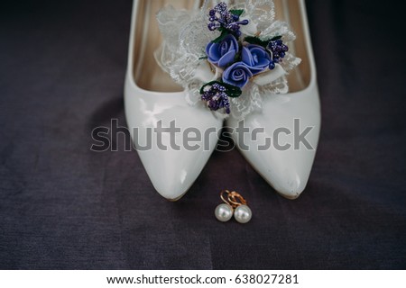 Bride accessories: lace blouse, garter, ballet flats, high-heeled shoes