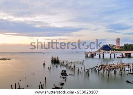 Beautiful long exposure view of Bangsaen beach while sunset in Chonburi Thailand