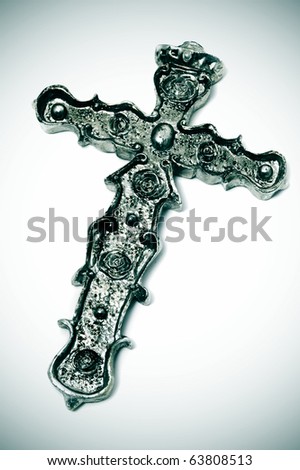 an emo cross isolated on a white vignetted background