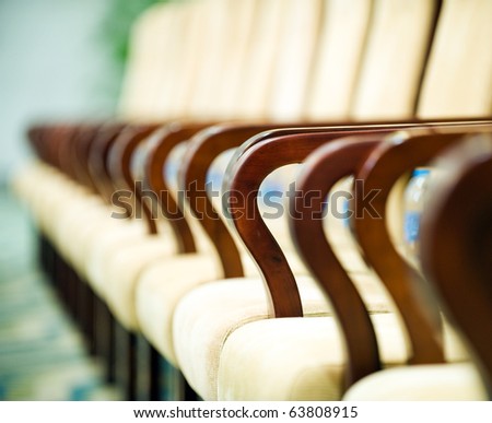 Row of chairs in boardroom.  Macro with extremely shallow depth of field.